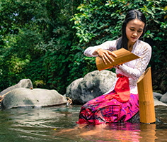 Balinese woman at river